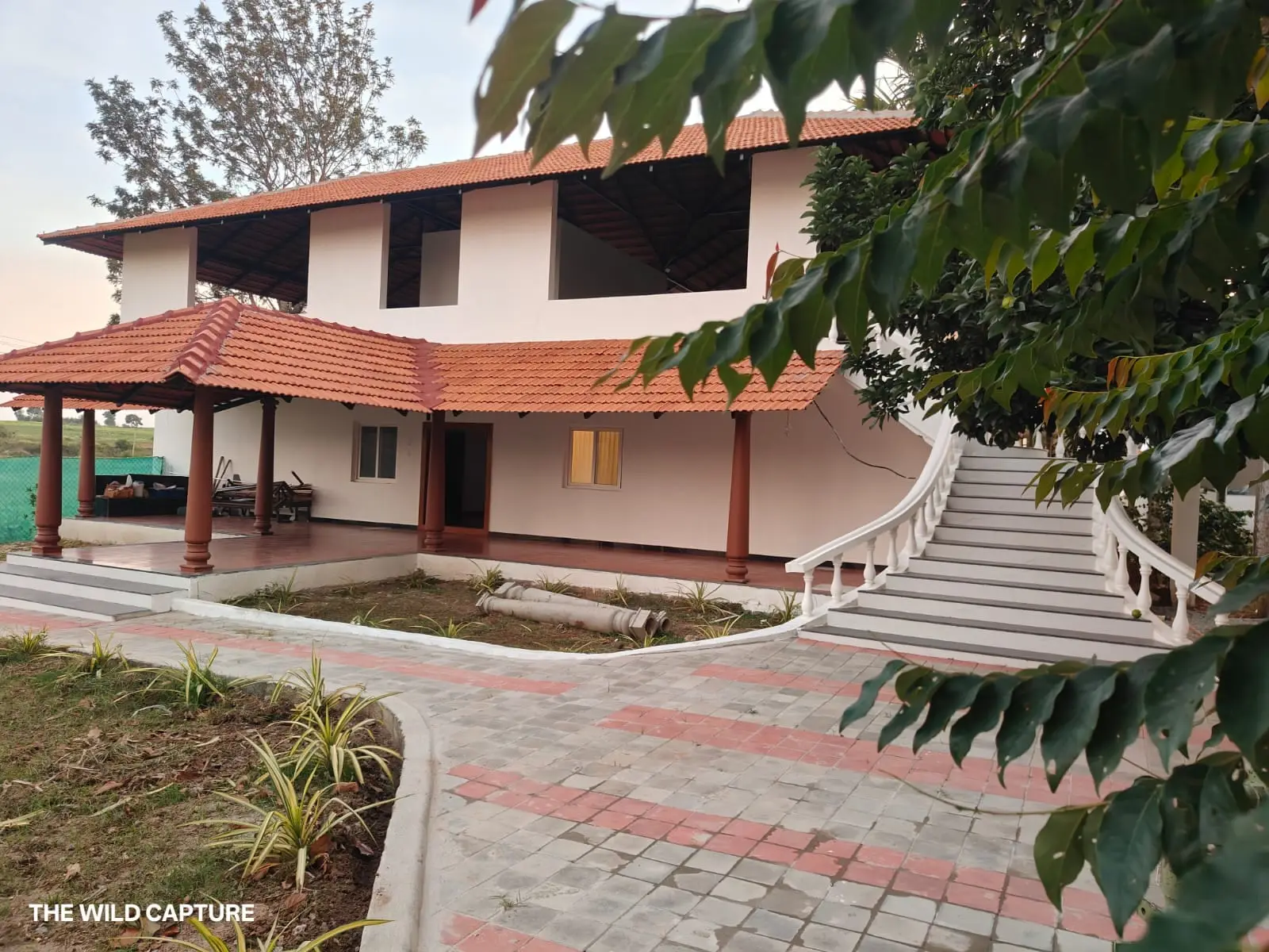 Front of the villa with its Malnad tiled roof and pillared verandah